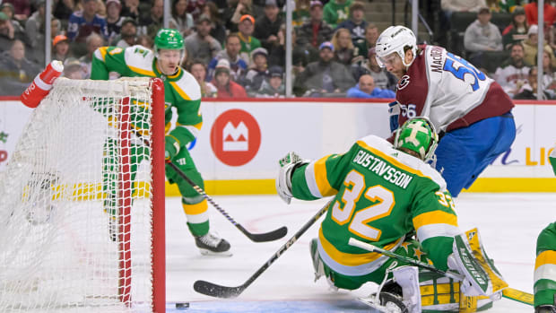 Nov 24, 2023; Saint Paul, Minnesota, USA; Colorado Avalanche defenseman Kurtis MacDermid (56) beats Minnesota Wild goalie Filip Gustavsson (32) for a goal during the third period at Xcel Energy Center.